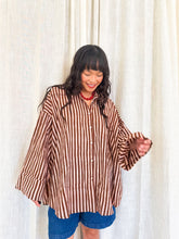 Load image into Gallery viewer, Front view of model wearing the Signature Big Shirt in brown stripe, block-printed, cotton