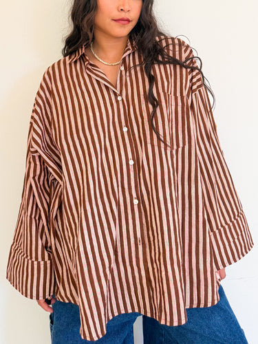 Front view of model wearing the Signature Big Shirt in brown stripe, block-printed cotton