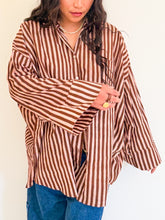 Load image into Gallery viewer, Model wearing the Signature Big Shirt showing wide sleeves and hand block-printed cotton fabric with sleeve buttons