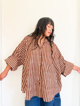 Load image into Gallery viewer, Front view of model wearing the Signature Big Shirt in brown stripe, oversized fit, block-printed, cotton
