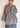 Front view of model wearing the Signature Big Shirt in black stripe, showing oversized sleeves and block-printed cotton
