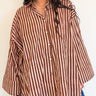 Front view of model wearing the Signature Big Shirt in brown stripe, block-printed cotton