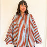 Front view of model wearing the Signature Big Shirt in blue and brown stripe, showing oversized fit and hand block-printed cotton
